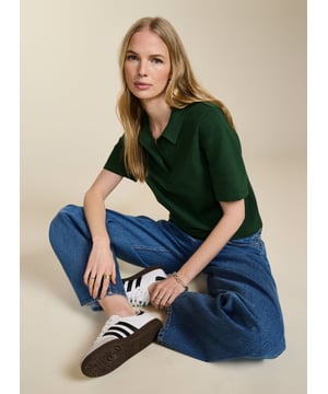 Description\nFits true to size, we suggest ordering your usual size.\nWe love the ease and versatility of a classic polo top. Margaret’s shape is slightly cropped with a relaxed fit and concealed buttons for a contemporary twist on a loyal piece. But best of all, this style is as low-impact as possible thanks to regenerative cotton, which is the most environmentally-conscious way of farming for fabrics. A proud new addition to Baukjen Lab. \n\nMade in Europe\nCrafted in regenerative cotton  \nRelaxed, cropped shape \nPulls on\n\n\nSustainable Attributes:\n\n\n Low Impact \n \n Low Water Use \n \n Natural fibres \n \n Ethically made \n\n Vegan \n \n Low Carbon \n\nDetails\n Model is 5'10 (177cm) and is wearing a UK 10\n96% Regen Cotton, 4% Elastane\nDelicate Machine Wash - 30°\nProduct code: TP40767-AQW \nBack shoulder at neck to hem - 53cm (20 7/8)\nSleeve length - 26.5cm (10 3/8)