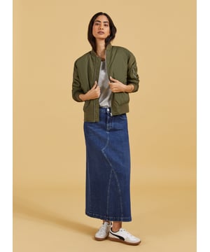 Description\nThe Nia skirt is nostalgic dressing at its finest! This style in organic cotton denim is quite literally a jeans skirt, with the waistband and fastenings borrowed from a classic pair of jeans. It’s cut to hug the waist and hips before gently flaring out into an a-line shape. A casual saviour, we’ll be wearing it with tees, boyfriend shirts and bomber jackets.\n\nMade in Europe\nCrafted in organic cotton denim\nStretchy\nAnkle length\nZip fly and button fastening\n\n\nSustainable Attributes:\n\n  \n Low Impact \n\n Low Water Use \n    Natural fibres \n    Ethically made \n    Organic \n\nDetails\nModel is 5'10 (177cm) and is wearing a UK 1099% Organic Cotton, 1% ElastaneProduct code: SK40178-DINCentre back waist to hem - 92cm (36 ⁷/₃₂)