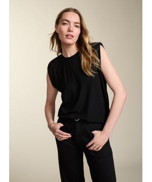 Description\nFits true to size, we suggest ordering your usual size.\nDon’t be fooled into thinking that Alessia is just another sleeveless top; we’ve added subtle shoulder pads to create definition along the shoulders, which also flatters the arms. Cut from our signature soft and stretchy jersey, it drapes across the body and is set to be your secret styling weapon on warm days.\n\nMade in Europe\nCrafted in LENZING™ ECOVERO™ jersey\nRelaxed fit\nWardrobe staple\n\n\nSustainable Attributes:\n  Low Impact   Low Water Use  Ethically made  Vegan   Low Carbon  \n\nDetails\nModel is 5'10 (177cm) and is wearing a UK 1095% LENZING™ ECOVERO™ Viscose, 5% ElastaneDelicate Machine Wash - 30°Product code: TP40774-BLKBack shoulder at neck to hem - 61cm (24)