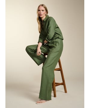 Description\nFits true to size, we suggest ordering your usual size.\nConsider Yvonne as a ‘semi-smart’ trouser - they blend the elegance of wide-leg tailoring with the comfort of an elasticated waistband (really!). This style in lightweight hemp features a pintuck down each leg and a simple, fuss-free front. We’ll be styling them with the matching Della Hemp Shirt for a low-maintenance co-ord.  \n\nMade in Europe \nCrafted in hemp \nPockets in side seams \nSimply pull on  \n\n\nSustainable Attributes:\n\n \n Low Water Use \n \n Natural fibres  \n \n Ethically made  \n \n Vegan  \n \n Low Carbon \n\n\nDetails\n Model is 5'10 (177cm) and is wearing a UK 10100% Hemp \nDelicate Machine Wash - 30°\nProduct code: TR40350-LKH \nInside leg - 80cm (31 1/2)