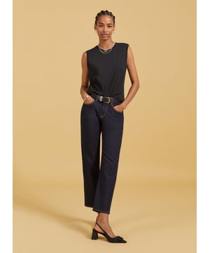 Description\nSlim fit. For a looser look, we suggest sizing up from your usual size.\nAmber isn’t a vest top nor a classic tee - she’s perfectly in-between. Cut for a neat fit and designed to just meet the top of your jeans and chinos, it’s a casual basic you’ll wonder how you got by without. In organic stretch cotton, it’s comfortable too. Prepare to wear on repeat.\n\nMade in Europe\nCrafted in organic stretch cotton\nFitted\nShaped armholes\n\n\nSustainable Attributes:\n\n    Low Impact \n  \n Low Water Use \n    Natural fibres \n   Ethically made\n    Low Carbon \n  Organic \n\nDetails\n95% Organic Cotton, 5% Elastane Delicate Machine Wash - 30°Product Code: TP40715-BLKBack shoulder at neck to hem - 53cm (20 7/8)