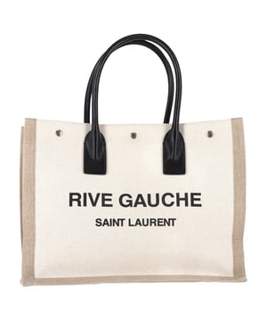 VINTAGE, RRP AS NEW
The ultimate tote for stylish escapes. The Saint Laurent Natural Rive Gauche Tote Bag in white linen is your new go-to for travel, beach days, or city strolls. Crafted from durable linen with a protective coating on both sides, it’s as functional as it is fashionable. The bold Rive Gauche logo print and sturdy leather handles add just the right amount of edge to its classic silhouette.


Saint Laurent Natural Rive Gauche Tote Bag in White Linen
Condition: Excellent
Signs of wear: No retail tag, No visible sign of wear., 
Packaging: None
Color: White | ecru
Material: linen and leather
Size: One Size | One Size
Measurements: Width: 170; Height: 280; Length: 400; Handle drop: 160; Strap length: 0
SKU: NAPPUGBBA484459W