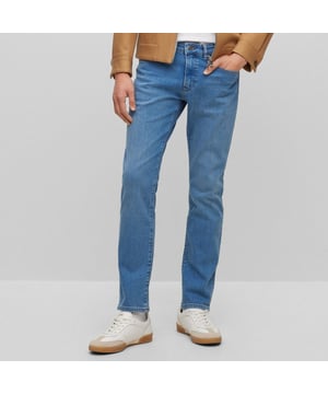 Men's Boss Delaware3-1 Slim-Fit Jeans. Slim Fit Jeans with a modern feel, borrowing the best elements of denim to create a pair that is simultaneously functional and fashionable. This pair features a blue wash design with tonal hardware logo at front pocket and distressed logo at rear waistband. Material: 99% Cotton, 1% Elastane. Ref: 50496102445.