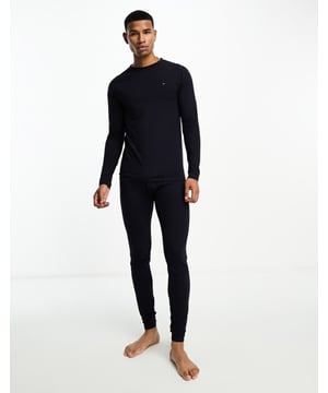 Pyjamas by Tommy Hilfiger Comfort zone: entered Elasticated waist Branded taping Fitted cuffs Slim fitSold By: Asos