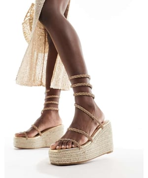 Shoes by SIMMI Shoes Sun's out, toes out Wrap-around design Diamante embellishment Open toe Rope midsole High wedge heelSold By: Asos
