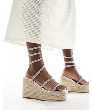 Shoes by SIMMI Shoes Sun's out, toes out Wrap-around design Diamante embellishment Open toe Rope midsole High wedge heelSold By: Asos