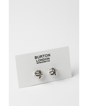 Intricately designed knot detailing for a sophisticated finish
        Polished metal construction offering durability and a refined lustre
        Classic T-bar fastening for secure and easy attachment
        Versatile size that complements both standard and French cuffs
        Presented on a branded Burton card, perfect for gifting
    
    These Silver Knot cufflinks add a distinguished touch to any formal ensemble. The timeless knot design reflects traditional British craftsmanship while providing subtle visual interest at the cuff. Perfect for elevating your work attire or completing a wedding outfit, these cufflinks demonstrate attention to detail without being ostentatious. Pair with a crisp white shirt and tailored Burton suit for important meetings, or use them to sharpen a smart casual look when heading out for evening drinks. The versatile design works equally well for milestone celebrations or everyday office wear, making them an essential accessory for the modern gentleman who appreciates classic styling with contemporary relevance. Their understated elegance ensures they'll remain a wardrobe staple for years to come.