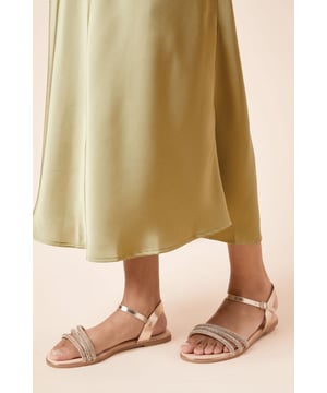Faux leather upper with embellished straps
Slip-on style for easy on and off
Wide fit for added comfort
Flat sole for all-day wearability
Versatile monochrome design

Effortlessly elevate your warm-weather looks with these faux leather sandals from Dorothy Perkins. The wide fit and flat sole offer exceptional comfort, while the embellished straps add a touch of glamour. Pair them with a flowy midi dress for a chic brunch ensemble or team them with tailored trousers and a blouse for a polished daytime look suitable for casual events and family gatherings.