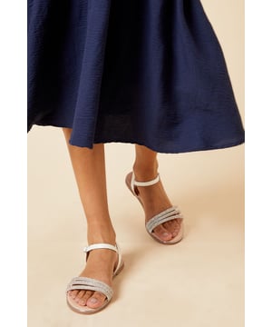 Faux leather upper with embellished straps
Slip-on style for easy on and off
Wide fit for added comfort
Flat sole for all-day wearability
Versatile monochrome design

Effortlessly elevate your warm-weather looks with these faux leather sandals from Dorothy Perkins. The wide fit and flat sole offer exceptional comfort, while the embellished straps add a touch of glamour. Pair them with a flowy midi dress for a chic brunch ensemble or team them with tailored trousers and a blouse for a polished daytime look suitable for casual events and family gatherings.