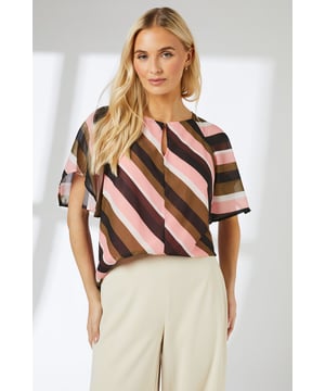 Distinctive hanky hem design creates a flowing silhouette
        Elegant keyhole neckline with delicate tie detail
        Short sleeves with subtle flare for added movement
        Bold diagonal stripe pattern for eye-catching visual interest
        Relaxed fit with generous cut for all-day comfort
    
    This Principles blouse combines contemporary style with effortless wearability. The striking diagonal stripe pattern creates visual intrigue while the hanky hem adds a touch of feminine flair to your everyday wardrobe. Style with wide-leg trousers as shown for a balanced silhouette that works beautifully for casual office days or weekend brunches. The keyhole neckline offers a subtle hint of sophistication, making this piece versatile enough to transition from day to evening. For a complete daytime look, pair with tailored cream trousers and flat loafers, adding minimal jewellery to let the blouse's distinctive pattern take centre stage. Perfect for family gatherings or casual coffee dates where comfort meets style.