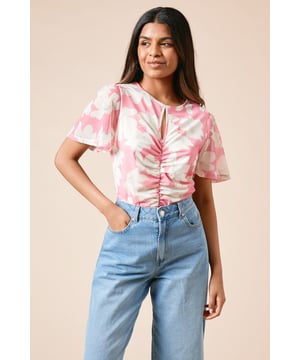 Delicate keyhole detail at the neckline adds a subtle feminine touch
        Ruched front detailing creates a flattering silhouette
        Floaty angel sleeves offer elegant movement and coverage
        Lightweight mesh fabric provides comfort with a touch of stretch
        Regular fit design perfect for everyday wear
    
    This Dorothy Perkins floral mesh top combines comfort with style for the modern woman. The ruched front detailing creates a figure-flattering effect, while the angel sleeves provide just the right amount of coverage for those who prefer not to show too much skin. Style this versatile piece with wide-leg denim jeans and sandals as shown for casual brunches with friends, or dress it up with tailored trousers for family gatherings. The crew neckline with keyhole detail adds interest without being overstated, making this top perfect for baby showers or weekend outings. The regular fit ensures comfort throughout the day, while the pretty floral pattern works beautifully across seasons. Simply accessorise with delicate jewellery to complete your look.