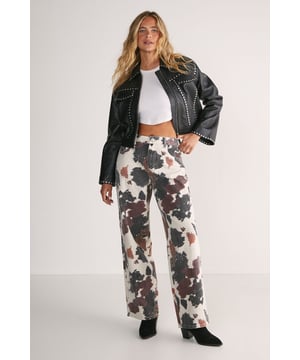 Striking cow print pattern for a bold statement look
        Straight leg silhouette offering a relaxed yet structured fit
        100% cotton denim fabric for comfort and durability
        Classic five-pocket design with traditional contrast stitching
        High-rise waistband for a flattering silhouette
    
    Make a statement with these eye-catching cow print straight leg jeans from Nasty Gal. The distinctive pattern transforms a casual wardrobe staple into a conversation starter, whilst the straight leg cut offers versatility for various styling options. Pair with a simple white crop top and leather jacket for an edgy daytime look, or dress them up with a fitted black bodysuit and heels for evening drinks. The cotton denim construction ensures these jeans maintain their shape whilst providing all-day comfort. Perfect for casual outings, family gatherings or weekend brunches, these jeans work brilliantly with trainers for a relaxed vibe or ankle boots for added attitude. The high-rise design flatters the waistline and pairs wonderfully with both tucked-in and cropped tops. These statement jeans will quickly become your go-to piece for adding character to any casual ensemble.