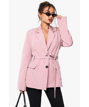 Stylish blazer featuring contrast button detailing for a distinctive touch
        Adjustable belt to cinch the waist and create a flattering silhouette
        Classic collared neckline offering a sophisticated structured look
        Practical front pockets perfect for small essentials or a chic styling detail
        Regular fit design providing comfortable movement while maintaining shape
    
    This versatile belted blazer bridges the gap between casual cool and evening elegance. The contrast buttons add a contemporary twist to a timeless silhouette, whilst the waist-defining belt creates a feminine shape that works beautifully for nights out. Style with slim-fit black trousers and strappy heels for drinks with the girls, or dress down with cropped leggings and flat sandals for a more relaxed urban look. The structured collar frames the face beautifully, making this piece ideal for those wanting to make a statement. For cooler evenings, layer over a simple camisole or bodysuit, adding statement jewellery to complete your look. This Boohoo blazer is the perfect investment piece for the fashion-forward woman who demands versatility from her wardrobe.