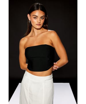 Sleek bandeau design with a structured silhouette for a confident, fashion-forward look
        Part of the exclusive RUNWAY 1.8.1.8 collection, showcasing contemporary design elements
        Secure fit with back zip closure for easy wear and removal
        Versatile cropped length perfect for high-waisted styling options
        Stretchy jersey fabric offers comfortable wear whilst maintaining shape throughout the evening
    
    Make a striking statement with this sophisticated Warehouse bandeau top from the RUNWAY 1.8.1.8 collection. The clean, minimalist design creates a refined canvas for your most memorable occasions. Style with flowing wide-leg trousers as shown for an elegant contrast that balances structure with movement. For formal events, pair with a tailored blazer and statement jewellery to create a contemporary ensemble that commands attention. The versatile design transitions seamlessly from daytime garden parties to evening cocktail events-simply switch your accessories to transform your look. This bandeau top reflects confident femininity with its sleek lines and modern proportions, making it an essential piece for the fashion-forward woman who appreciates understated elegance with an edgy twist.