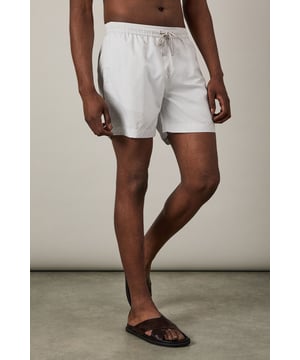 Lightweight woven swim shorts with subtle print detail
        Comfortable elasticated waistband with adjustable drawstring
        Quick-drying fabric perfect for beach and poolside wear
        Relaxed fit design for ease of movement
        Versatile mid-thigh length suitable for swimming and casual wear
    
    These Burton swim shorts combine practicality with understated style for the modern man. The subtle print adds visual interest without being overly bold, making them an excellent choice for various summer settings. Pair with a crisp linen shirt as shown for a sophisticated beach club look, or team with a plain t-shirt for casual beachside drinks. The versatile design transitions effortlessly from swimming to socialising, making them ideal for holiday packing. Perfect for family barbecues, coastal walks or simply lounging by the pool with a cold drink. These shorts reflect the practical sensibility that Burton is known for - comfortable enough for all-day wear yet smart enough to take you from daytime activities to evening gatherings at the local pub with friends. Add sandals and sunglasses to complete your relaxed summer ensemble.