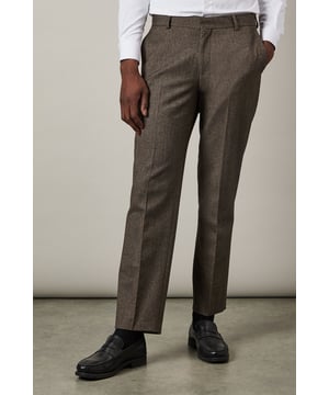 Distinctive herringbone pattern adds sophisticated texture to these tailored trousers
        Clean-cut tailored fit offers a refined silhouette while maintaining comfort
        Classic side pockets and rear welt pockets provide practical functionality
        Versatile design pairs perfectly with matching jacket and waistcoat for a complete suit
        Flat front design with belt loops for a sleek, contemporary appearance
    
    These Burton herringbone tailored trousers deliver timeless British style with modern sensibility. The classic herringbone weave creates subtle visual interest whilst maintaining versatility for various formal occasions. Pair with the matching jacket and waistcoat for a complete three-piece ensemble that commands attention in the boardroom, or dress down with a crisp white shirt for smart-casual events. The tailored fit defines your silhouette without restricting movement-perfect for the gentleman who appreciates traditional styling with contemporary proportions. These trousers transition seamlessly from important client meetings to weekend gatherings at your local. Complete the look with polished leather shoes and a coordinating belt for a sophisticated finish that reflects your discerning taste. An essential addition to any well-curated wardrobe.