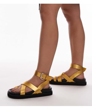 Shoes by Topshop Style with sunshine Adjustable ankle strap Cross-front straps Toe loop Moulded footbed Flatform sole Wide fitSold By: Asos