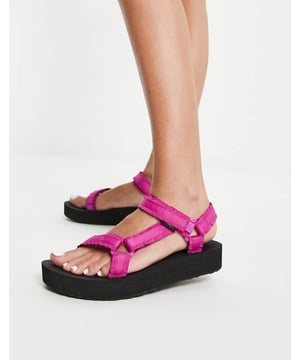 Shoes by Teva It's open-toe season Adhesive fastening Logo tab detail Open toe Textured footbed EVA midsole for lightweight cushioning Textured grip treadSold By: Asos