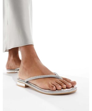 Shoes by SIMMI Shoes Give your feet some airtime Slip-on style Toe post Diamante embellishment Flat soleSold By: Asos