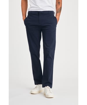 The Nines Cotton Trousers offer a classic, straight-leg fit with belt loops for a tailored look. Designed with side and back pockets for added convenience, these versatile trousers provide both style and practicality, making them a perfect addition to any wardrobe. Ideal for both casual and smart-casual wear.