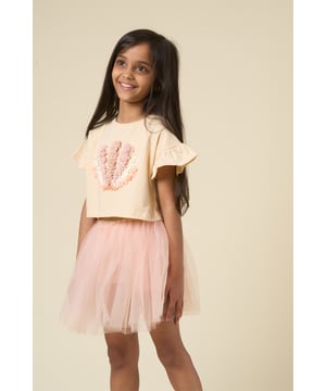 This cute set by Miss features a printed T-shirt with playful ruffle sleeves and a matching floaty skirt. Designed for twirling, exploring, and everything in between, it’s the perfect outfit for carefree days and fun-filled adventures.