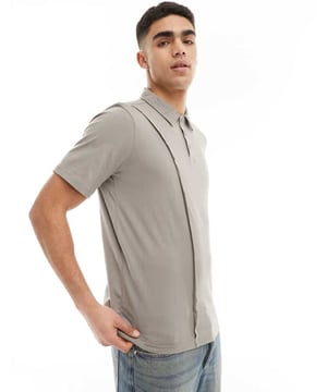 Polo Shirts by Bolongaro Trevor Your new go-to Polo collar Partial button placket Seam details Short sleeves Oversized fitSold By: Asos