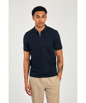 This zip-neck polo shirt from Kensington Eastside blends classic sophistication with modern design. Lightweight and breathable, it’s a versatile choice for smart-casual occasions, ensuring style and comfort effortlessly.