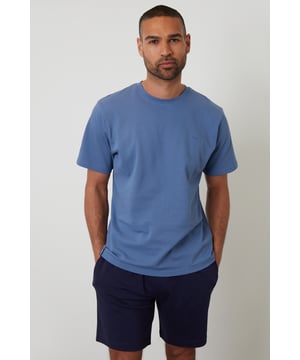 Experience ultimate comfort with this short pyjama set from Threadbare, designed for restful nights and easy lounging. Cut in a regular fit, this pyjama set is perfect for year round comfort. This set includes a short sleeve popcorn textured crew neck top with Threadbare embroidery on the chest and cotton shorts with an elasticated waistband, drawcords and two side pockets. Ideal for lounging or sleeping, this set is a must-have for your nightwear collection.