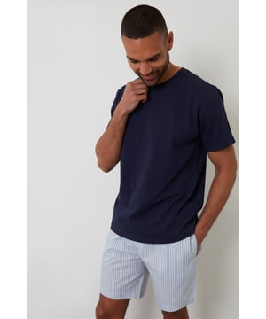 Experience ultimate comfort with this short pyjama set from Threadbare, designed for restful nights and easy lounging. Cut in a regular fit, this pyjama set is perfect for year round comfort. This set includes a short sleeve popcorn textured crew neck top with Threadbare embroidery on the chest and striped cotton poplin shorts with an elasticated waistband, drawcords and two side pockets. Ideal for lounging or winding down, this is a cosy and stylish addition to your sleepwear wardrobe.