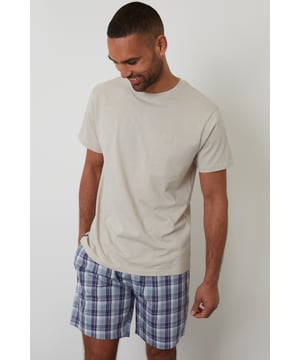 Unwind in comfort with this pyjama set from Threadbare, designed for a relaxed and effortless sleep. Cut in a regular fit, this pyjama set is perfect for year round comfort. This set includes a short sleeve crew neck top with Threadbare embroidery on the chest and checked cotton poplin lounge shorts with an elasticated waistband, drawcords and two side pockets. Ideal for lounging or sleeping, this set is a must-have for your nightwear collection.