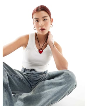 Tops by Vans Next stop: checkout Plain design Scoop neck Cropped length Racer back Slim fitSold By: Asos