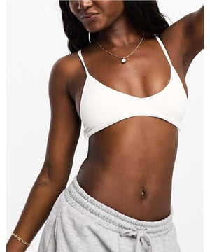 Tops by Cotton:On Treats for your top drawer V-neck Removable padding Adjustable straps Hook to reverse allows straps to be worn as a racerback Pull-on styleSold By: Asos
