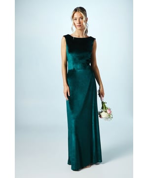 Luxurious velvet fabric for a sophisticated touch
        Elegant cowl back design adds a graceful flair
        Floor-length maxi silhouette for a dramatic look
        Sleeveless style perfect for formal occasions
        Fitted bodice accentuates the figure
    
    This stunning bridesmaids maxi dress from Coast is the epitome of elegance and grace. The sumptuous velvet fabric drapes beautifully, creating a sleek silhouette that's both flattering and comfortable. The cowl back detail adds a touch of allure, while the floor-length design ensures a sophisticated presence. Perfect for wedding celebrations, this dress is designed to complement the bride while allowing bridesmaids to shine. Style with delicate jewellery and strappy heels for a polished ensemble. The versatile design allows for easy movement on the dance floor, ensuring you'll look and feel fabulous throughout the festivities. This Coast creation is a timeless choice that will make any bridesmaid feel special on the big day.