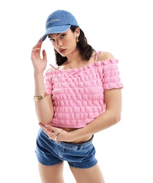 Tops by ASOS DESIGN Cos your jeans deserve a nice top Shirred finish Bardot neck Short sleeves Bow detail Cropped length Slim fitSold By: Asos