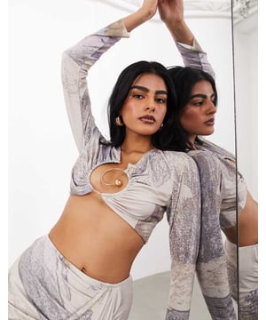 Tops by ASOS EDITION Part of a co-ord set Skirt sold separately Abstract design Plunge neck Long sleeves Spiral hardware Regular fitSold By: Asos