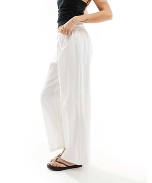 Trousers & Leggings by Collusion  High rise Elasticated waistband Button fly Straight fitSold By: Asos