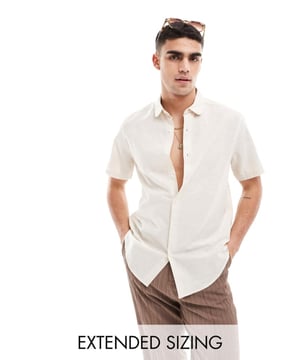Shirts by ASOS DESIGN Do the smart thing Plain design Penny collar Button placket Short sleeves Regular fitSold By: Asos