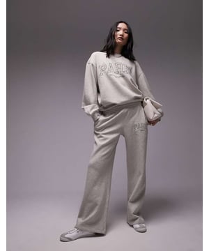 Trousers & Leggings by Topshop Welcome to the next phase of Topshop Sweatshirt sold separately Elasticated waistband Side pockets Text embroidery Straight fitSold By: Asos