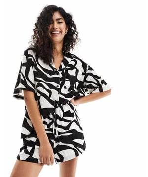 Shorts by ASOS DESIGN Style with sunshine All-over print High rise Elasticated drawstring waist Side pockets Regular fitSold By: Asos