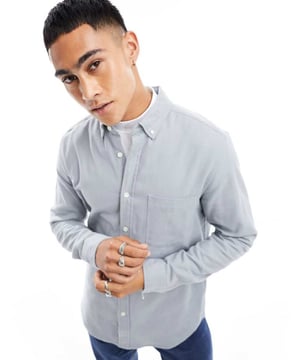 Shirts by ASOS DESIGN Your new go-to Button-down collar Button placket Chest pocket Long sleeves Regular fitSold By: Asos