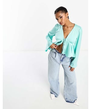 Tops by Pieces Waist-up dressing V-neck Flared sleeves Tie front Peplum hem Regular fitSold By: Asos