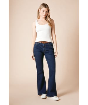 Flattering flared silhouette that gracefully widens from the knee
        Cotton-rich fabric with added stretch for all-day comfort
        Classic five-pocket design with traditional stitching detail
        Mid-rise waistband sits comfortably at the natural waist
        Versatile dark wash denim suitable for various casual occasions
    
    These Comfort Stretch Flare Jeans from Dorothy Perkins offer the perfect blend of retro charm and modern comfort. The flattering flared cut creates a balanced silhouette that works wonderfully with both fitted and relaxed tops. Style them as seen with a simple white vest and trainers for weekend brunches with the girls, or dress them up with a floaty blouse and ankle boots for family gatherings. The stretch-enhanced cotton fabric moves with you throughout the day, making these jeans ideal for shopping trips or casual coffee dates. The timeless dark wash ensures versatility in your wardrobe, while the classic pocket detailing maintains that authentic denim look. Perfect for the woman who appreciates contemporary style with practical comfort for her busy lifestyle.