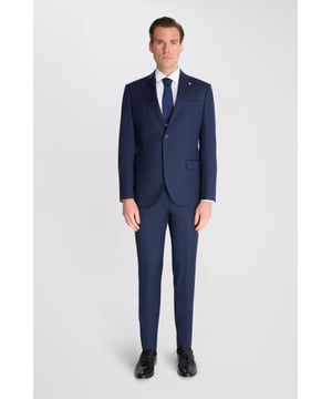 3-Piece Suit Set by Carter & Jones
Elevate your formal wardrobe with the 3-Piece Suit Set by Carter & Jones, designed for the discerning gentleman who values both style and sophistication. This suit set includes a jacket, trousers, and waistcoat, each featuring those classic details that ensure you stand out in any setting.

Jacket: A 2-Button Single Breasted design with a classic cut that exudes modern elegance. The jacket is equipped with two back vents for added comfort and ease of movement. Finished with a distinctive Contrasting Lapel Pin for a touch of personality, the jacket also offers 2 Flap Pockets, a chest pocket, and multiple internal pockets for practicality. Fully lined for a premium finish.

Trousers: Pleated trousers that offer a refined silhouette with a Hook and Bar Closure, combining comfort with style for an impeccable fit.

Waistcoat: A statement piece, featuring a Cinch Belt for a tailored fit, Silken Lining, and a Button Closure for that perfect polished look.

Slim Fit 

Main Fabric 68% Polyester 29% Viscose 3% Elastane.

Lining 100% Polyester.

Dry Clean Only.

This suit comes nested, meaning the trousers will have a 6 inch difference to the jacket (eg.: Jacket & Waistcoat - 38R | Trousers - 32R).

This 3-piece suit set is the ideal choice for weddings, business events, or any occasion that requires a sharp, sophisticated appearance. Carter & Jones delivers exceptional craftsmanship, ensuring you look your best with every wear.
