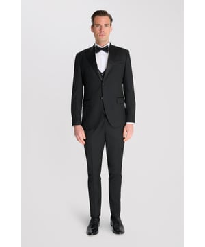 3-Piece Tuxedo Suit Set by Carter & Jones

Find your charm in this 3-Piece Tuxedo Suit Set by Carter & Jones, designed for the discerning gentleman who values both style and sophistication. This suit set includes a jacket, trousers, and waistcoat, each featuring those classic details that ensure you stand out in any setting.

Jacket: A 2-Button Single Breasted design with a classic cut that exudes modern elegance. The jacket is equipped with Satin details, two back vents for added comfort and ease of movement. The jacket also offers 2 Flap Pockets, a chest pocket, and multiple internal pockets for practicality. Fully lined for a premium finish.

Trousers: Pleated trousers that offer a refined silhouette with a buttoned and Hook and Bar Closure, combining comfort with style for an impeccable fit.

Waistcoat: A statement piece, featuring a Cinch Belt for a tailored fit, Silken Lining, and a Button Closure for that perfect polished look.

Slim Fit.

Main Fabric 68% Polyester 29% Viscose 3% Elastane

Lining 100% Polyester

Dry Clean Only

This suit comes nested, meaning the trousers will have a 6-inch difference to the jacket (e.g.: Jacket & Waistcoat - 38R | Trousers - 32R).

This 3-piece suit set is the ideal choice for weddings, business events, or any occasion that requires a sharp, sophisticated appearance. Carter & Jones delivers exceptional craftsmanship, ensuring you look your best with every wear.