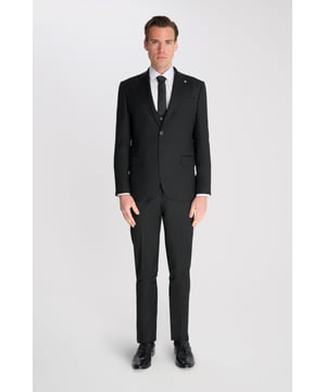 3-Piece Suit Set by Carter & Jones
Elevate your formal wardrobe with the 3-Piece Suit Set by Carter & Jones, designed for the discerning gentleman who values both style and sophistication. This suit set includes a jacket, trousers, and waistcoat, each featuring those classic details that ensure you stand out in any setting.

Jacket: A 2-Button Single Breasted design with a classic cut that exudes modern elegance. The jacket is equipped with two back vents for added comfort and ease of movement. Finished with a distinctive Contrasting Lapel Pin for a touch of personality, the jacket also offers 2 Flap Pockets, a chest pocket, and multiple internal pockets for practicality. Fully lined for a premium finish.

Trousers: Pleated trousers that offer a refined silhouette with a Hook and Bar Closure, combining comfort with style for an impeccable fit.

Waistcoat: A statement piece, featuring a Cinch Belt for a tailored fit, Silken Lining, and a Button Closure for that perfect polished look.

Slim Fit 

Main Fabric 68% Polyester 29% Viscose 3% Elastane.

Lining 100% Polyester.

Dry Clean Only.

This suit comes nested, meaning the trousers will have a 6 inch difference to the jacket (eg.: Jacket & Waistcoat - 38R | Trousers - 32R).

This 3-piece suit set is the ideal choice for weddings, business events, or any occasion that requires a sharp, sophisticated appearance. Carter & Jones delivers exceptional craftsmanship, ensuring you look your best with every wear.