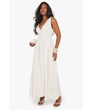 Textured crepe fabric with structured skater silhouette for added movement and flair
        Plunging V-neckline creates a striking focal point perfect for evening occasions
        Sleeveless design with elegant wide straps for comfortable support
        Maxi length with flowing skirt that gracefully skims the floor
        Pleated detailing at waist creates a flattering, feminine shape
    
    Make a statement at your next night out with this show-stopping skater maxidress from Boohoo. The textured crepe fabric adds subtle dimension while the plunging neckline creates a bold, confident look that demands attention. Style with strappy heels and statement bangles as seen on our model for a club-ready ensemble, or dress it up with metallic accessories and a sleek clutch for cocktails with friends. The flowing maxi silhouette moves beautifully as you dance, while the structured bodice provides a flattering fit that hugs in all the right places. This versatile piece transitions effortlessly from summer soires to autumn events with the addition of a cropped jacket. Perfect for those who want to combine comfort with head-turning style for urban nightlife adventures.