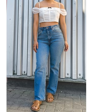 Elevate your casual style with our White Bow Detail Off Shoulder Top. This eye-catching piece features a flattering off-shoulder design with charming bow accents that add a touch of feminine flair. Perfect for summer days or evening outings, this versatile top pairs effortlessly with jeans, shorts, or skirts for a comfortable yet bold look that turns heads.