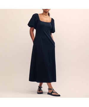 Women's Nobodys Child Talitha Midi Dress. Let’s talk about Talitha. You can’t go wrong with this classic black number. We love the flattering scoop neck, pretty puff sleeves and swishy skirt. Turn around to show off the statement tie back detail. Just add your favourite gold accents. Scoop neck.- Short puff sleeves.- Tie back detail.- Panelled waist designed to flatter.- Relaxed skirt that skims the body. Material: 70% Organic Cotton, 30% Linen. Ref: D242135BLK.