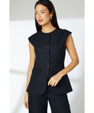 Sleek tailored waistcoat with distinctive cap sleeves for a contemporary silhouette
        Clean crew neckline complemented by statement button-through front closure
        Practical front pockets add functionality without compromising the streamlined design
        Subtle back detail with decorative buttons for added interest
        Regular fit offering comfortable movement whilst maintaining a polished appearance
    
    This versatile Principles waistcoat brings modern sophistication to your daywear collection. The clean lines and cap sleeve detail create a refined yet relaxed silhouette that works beautifully for various casual occasions. Style with the matching wide-leg trousers as shown for an effortlessly coordinated look, or pair with slim-fit denim and trainers for a smart-casual weekend ensemble. The structured woven fabric provides just enough stretch for all-day comfort, making it ideal for family gatherings or lunch with friends. Add simple gold-toned jewellery and a structured tote for a polished finish. This piece transitions seamlessly from day to evening - simply swap your flats for a block heel and add a bold lip colour for after-work drinks or dinner dates.