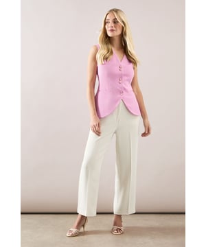 Tapered design creates a flattering silhouette that narrows towards the ankle
        Smooth woven fabric with added stretch for day-long comfort
        Clean front seam detail adds a sophisticated touch
        Side pockets provide practical functionality
        Versatile ankle-length cut perfect for showcasing statement footwear
    
    These elegant tapered trousers from Wallis combine sophistication with everyday comfort. The streamlined silhouette offers a contemporary look whilst maintaining a relaxed feel, making them ideal for various daytime occasions. Style them as shown with a button-detail top for family gatherings or weekend brunches. The ankle-length cut pairs beautifully with strappy sandals during warmer months or with ballet flats and a lightweight jumper for cooler days. For a polished casual look, team with a tucked-in blouse and a structured tote bag. The versatile design transitions effortlessly from office to casual outings, whilst the added stretch ensures comfort throughout the day. These trousers are a wardrobe essential that will complement numerous existing pieces in your collection.